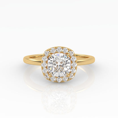 An exquisite yellow gold cushion-cut diamond ring featuring 1 carat diamond in a halo setting.