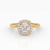 An exquisite yellow gold cushion-cut diamond ring featuring 1 carat diamond in a halo setting.